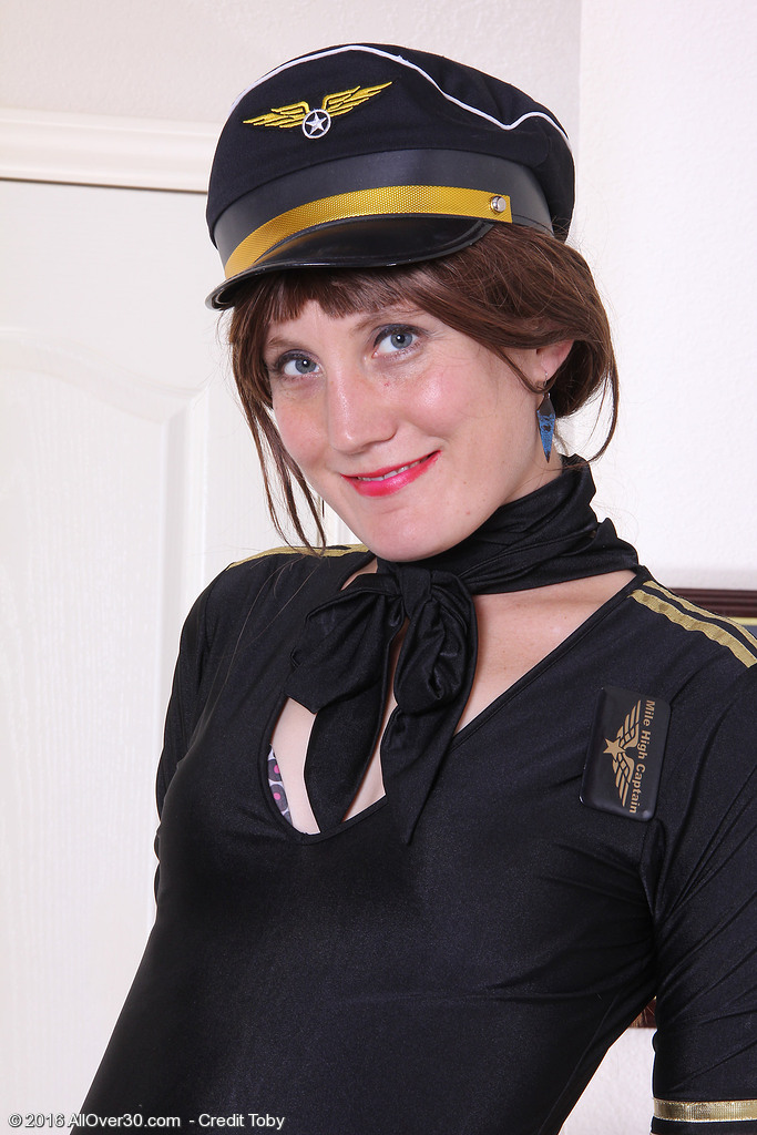 Sultry redhead Katrina Mathews is dressed up as a sexy airline pilot Mature Porn Pics